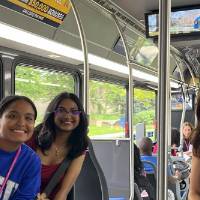 Students taking a ride on the LakerLine at GVSU during orientation